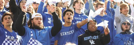 Students cheering at a UK Football game.