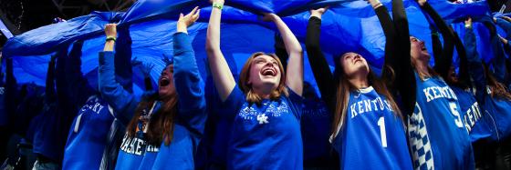 Students in the eRUPPtion Zone cheering a UK men's basketball game.