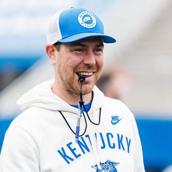 Head Coach Will Stein with whistle in his mouth at practice